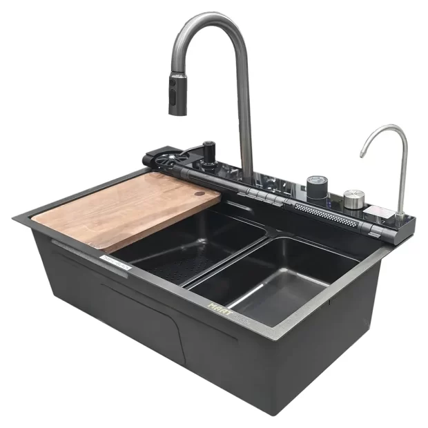 A sophisticated black dual-bowl kitchen sink with a high-arc pull-down faucet and integrated LED smart control panel. The system is configured with a wooden cutting board and strainer tray, illustrating the Smart Sink Black L-Series workstation features.